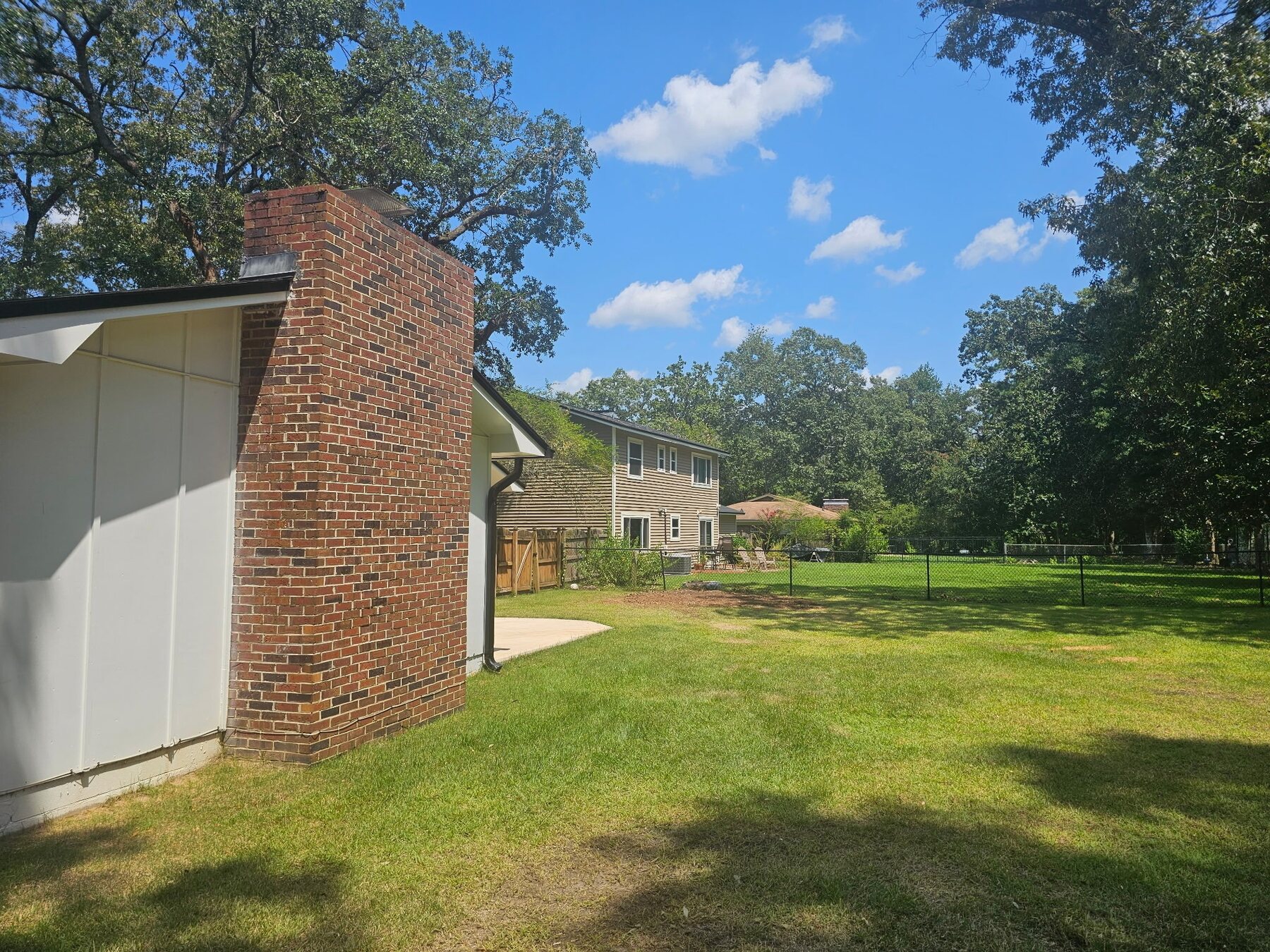 Cleared residential yard after tree and brush removal